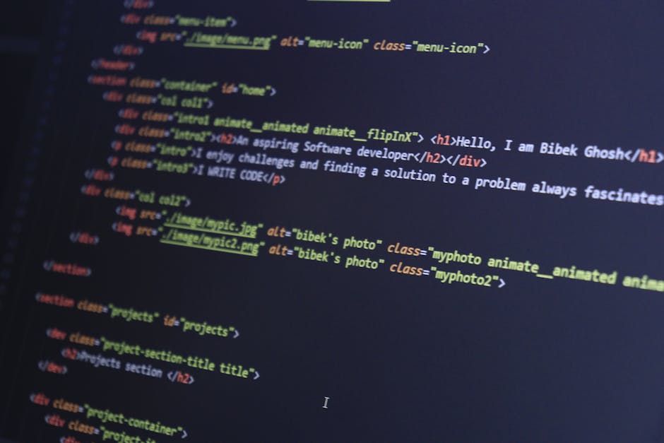 Close-up view of a computer screen displaying lines of HTML code, with syntax highlighting in various colors. The code includes tags such as <h1> and <div>, along with references to image files like '